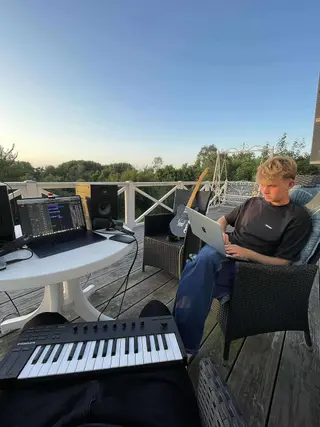 A keyboard and laptop session outdoors