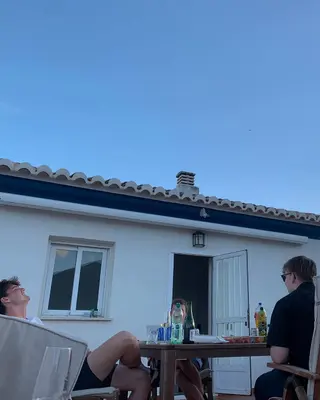 An outdoor music session under a blue sky