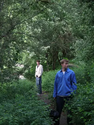 The duo beneath trees